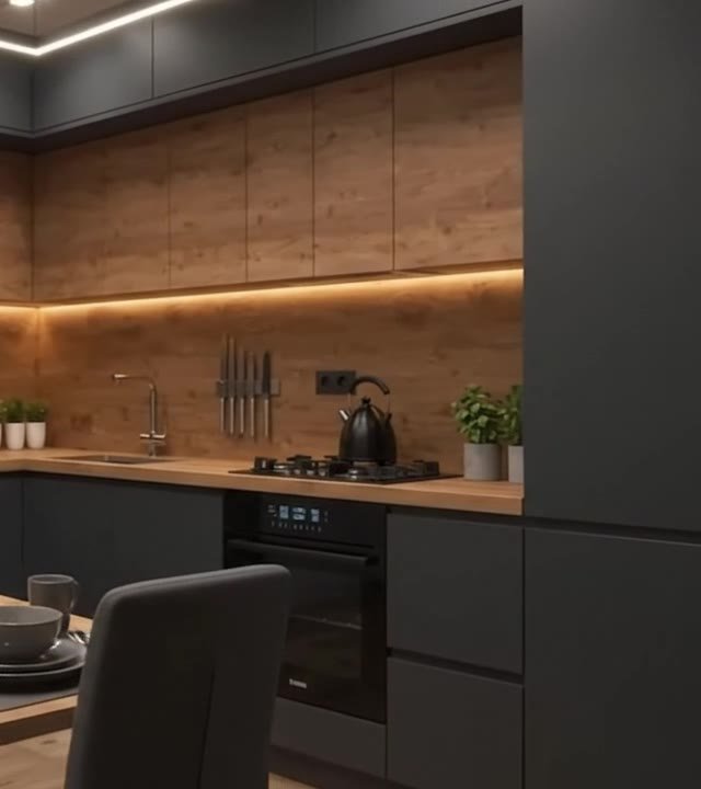 Charcoal tall units with an integrated oven beside an oak wall